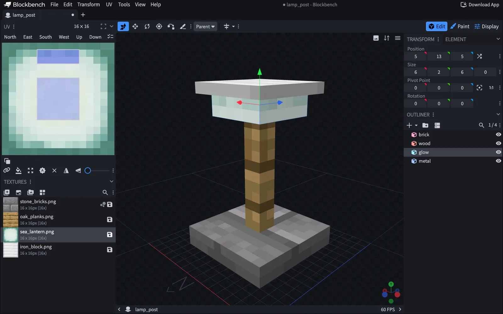 The lamp post model in Blockbench: a stone brick base, an oak post, a pale green lamp and an iron cap, with the lamp element selected and its position, size and pivot point shown in the Transform panel.