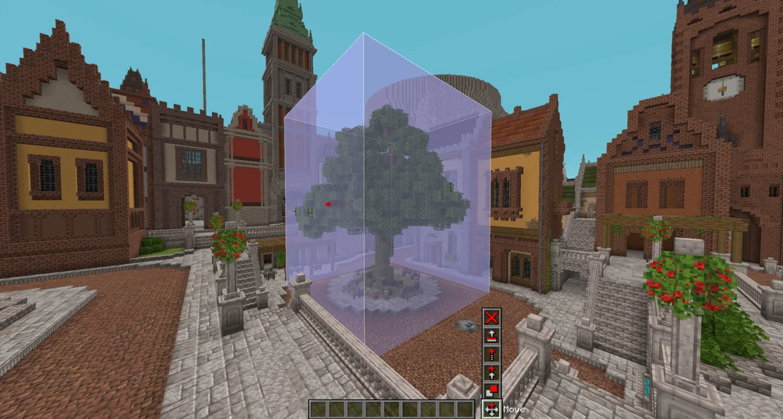 A large tree inside a translucent selection box in the middle of a brick town square, with a small tool bar and the Move tool name at the bottom of the screen.